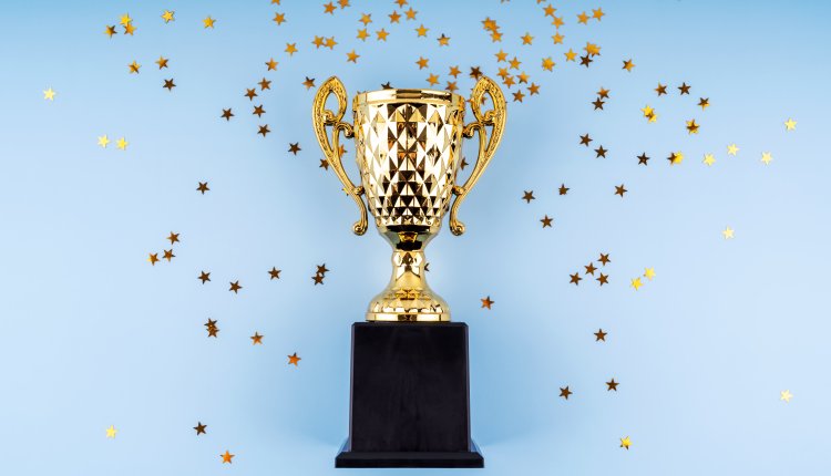 Golden Trophy With Star Shape Glitter Flat Lay